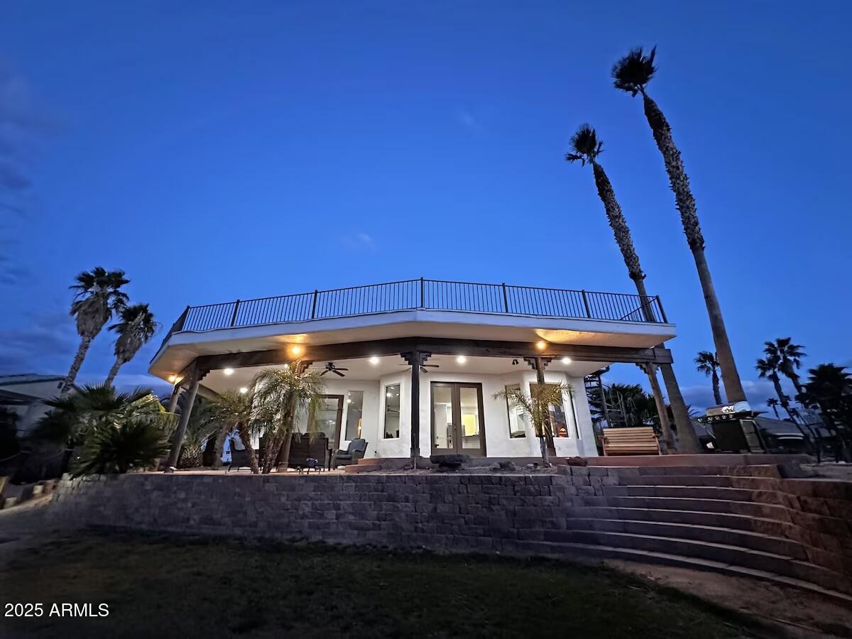 a view of a chairs and table in the patio