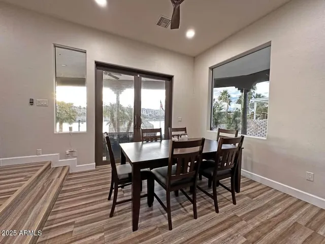 a view of a dining room with furniture window and outside view