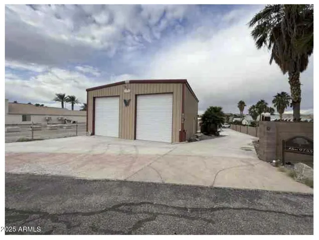 a picture of a room with a white wall and a refrigerator