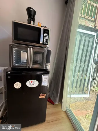 a view of a livingroom with a flat screen tv and washer