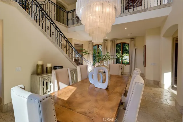 a living room with furniture a large window and a flat screen tv