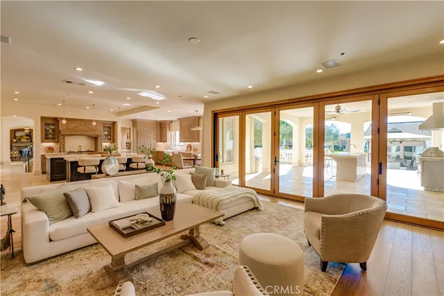 a view of swimming pool with outdoor seating and plants