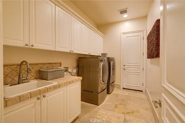 a bedroom with furniture and a large window