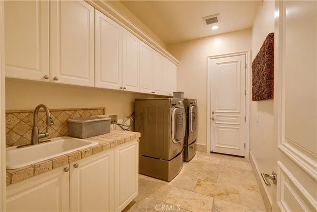 a bedroom with furniture and a large window