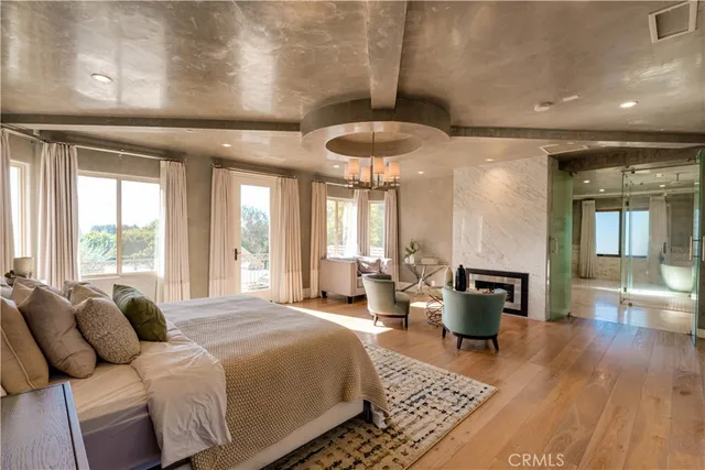 a view of a backyard with table and chairs and a fire pit