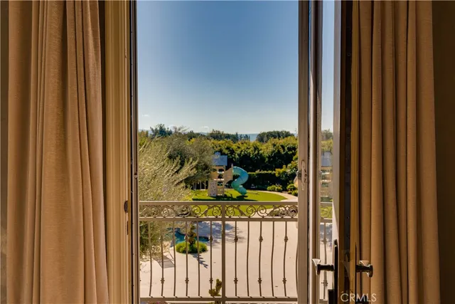 a view of a house with swimming pool and sitting area