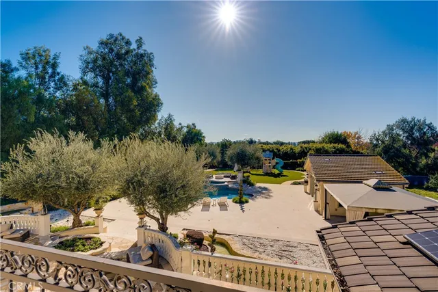 an aerial view of a house with yard swimming pool and outdoor seating