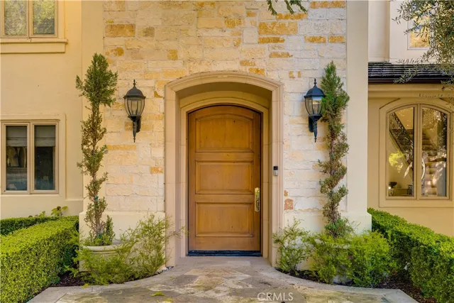 a view of a dining room with furniture and a chandelier