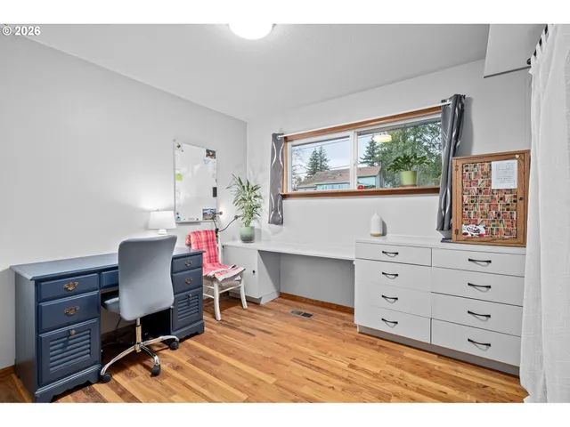 a bathroom with a shower sink vanity mirror and toilet