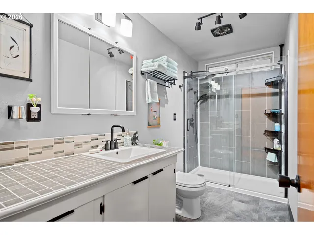 a bed room with a bed and a table