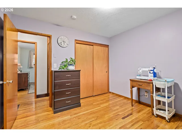 a dining room with furniture and a floor to ceiling window