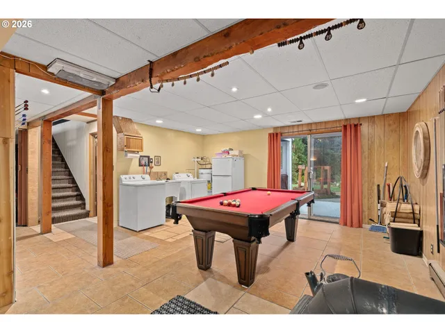 a room with furniture and air hockey table