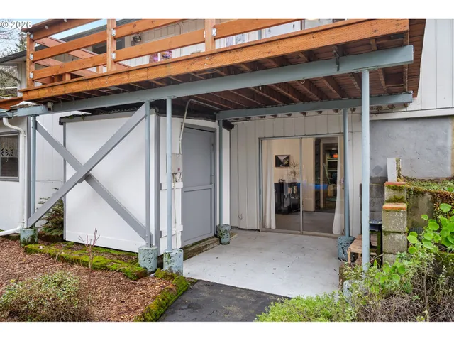 a view of a house with a yard porch and sitting area