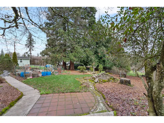a backyard of a house with lots of green space