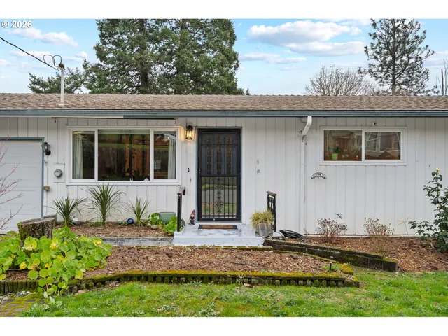 a view of living room with furniture and floor to ceiling window