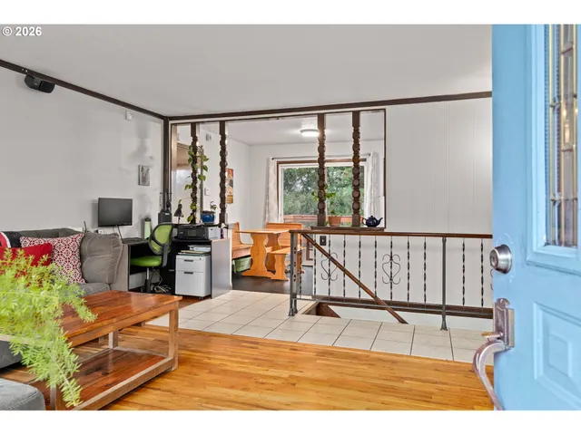 a room with furniture pool table and flat screen tv