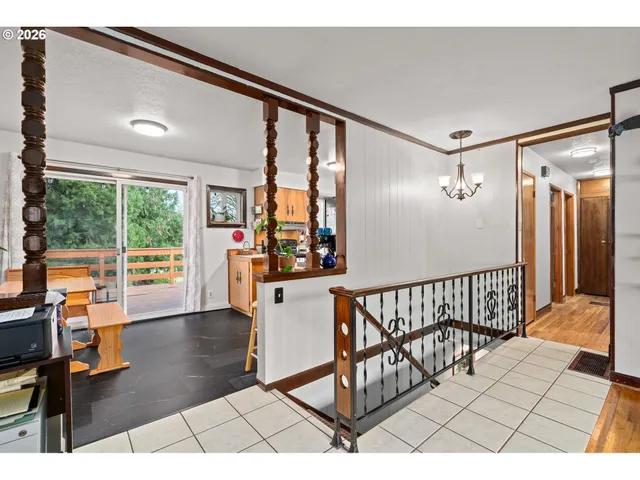 a dining room with a table and chairs