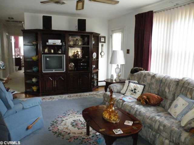 5808 West Rois Road Richmond, VA 23227 - Photo 4 of 11 Living Room - Large Living room includes a Brick fireplace with gas logs!