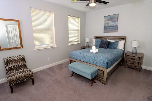 a bedroom with a bed and a couch