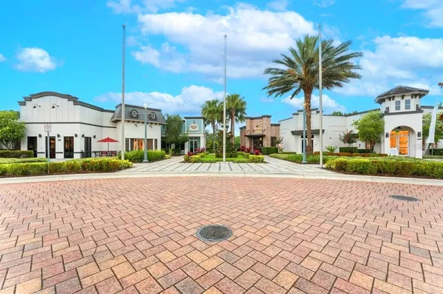 a view of multiple houses with a street