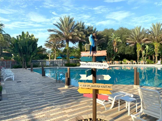 a view of swimming pool with chairs