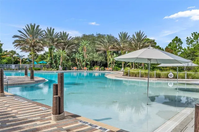 a view of a swimming pool with a patio