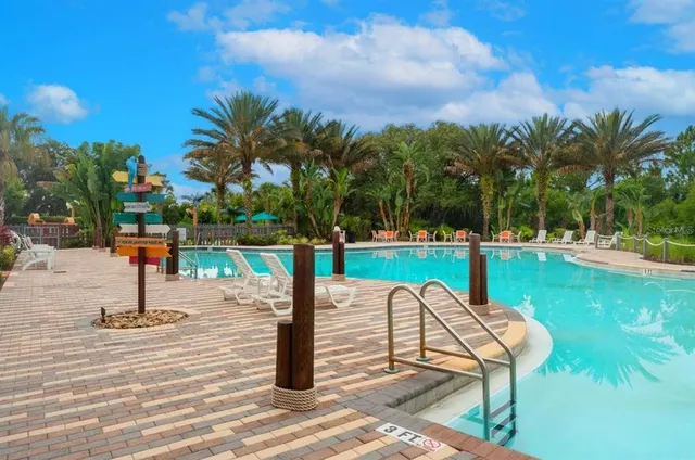 a view of a swimming pool with a patio