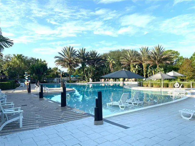 an aerial view of a house with yard
