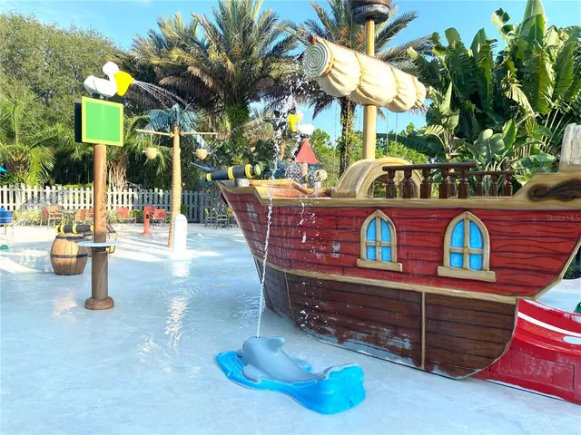 a view of swimming pool with sitting area