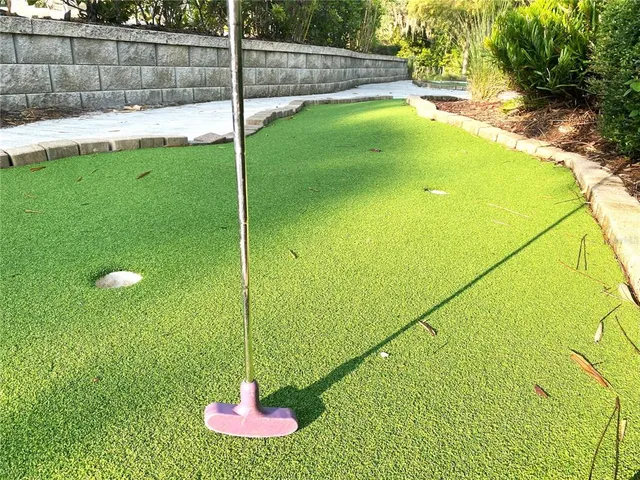 a view of a swimming pool with a yard
