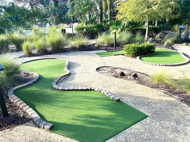 a view of a backyard with swimming pool
