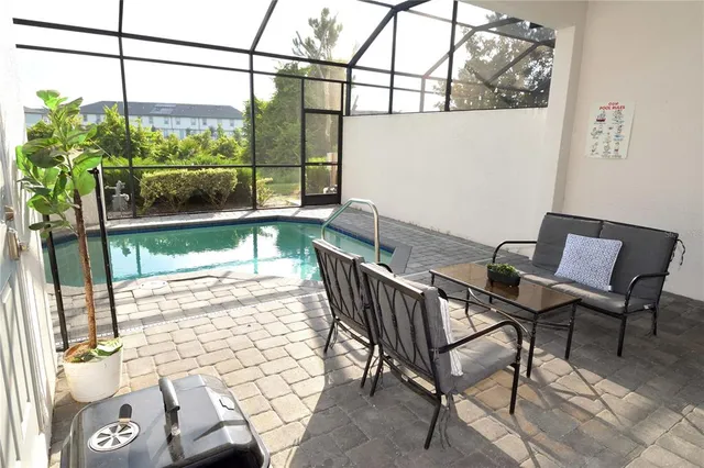 a view of a chairs and table in the balcony