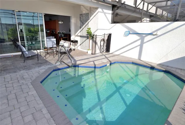 a view of a swimming pool with a patio