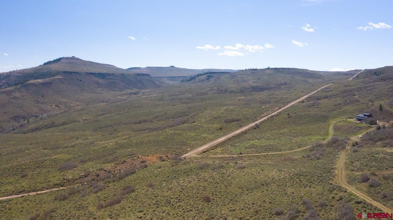 14111 County Road 26 Gunnison, CO 81230 - Photo 15 of 35 a view of a dry field with mountains in the background