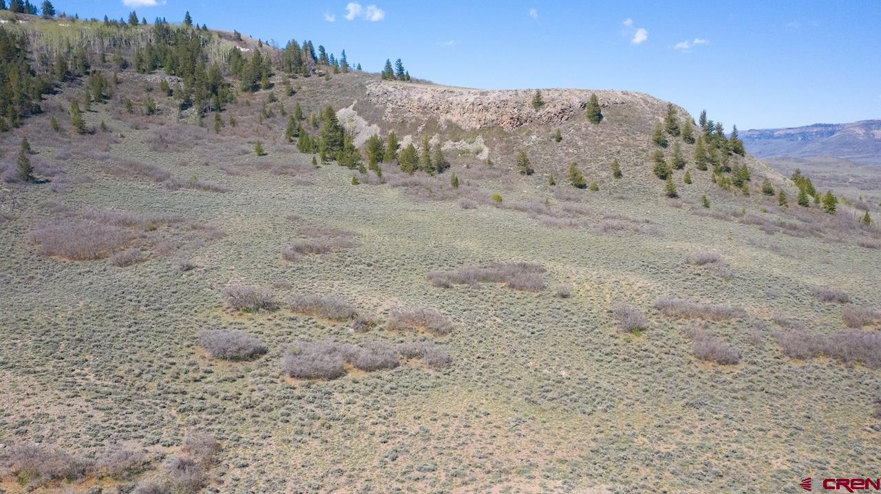 14111 County Road 26 Gunnison, CO 81230 - Photo 20 of 35 a view of dirt field with mountain in the background
