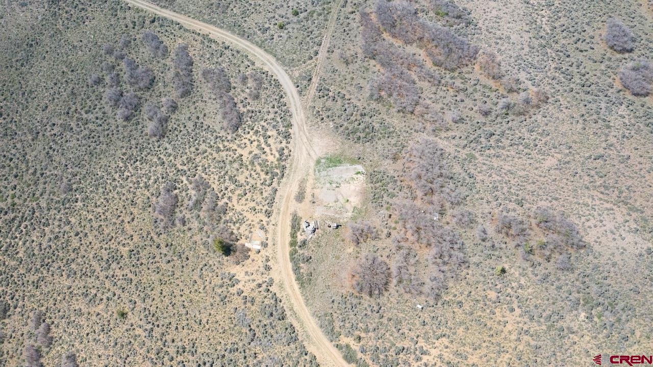 14111 County Road 26 Gunnison, CO 81230 - Photo 22 of 35 a bathroom with a shower curtain