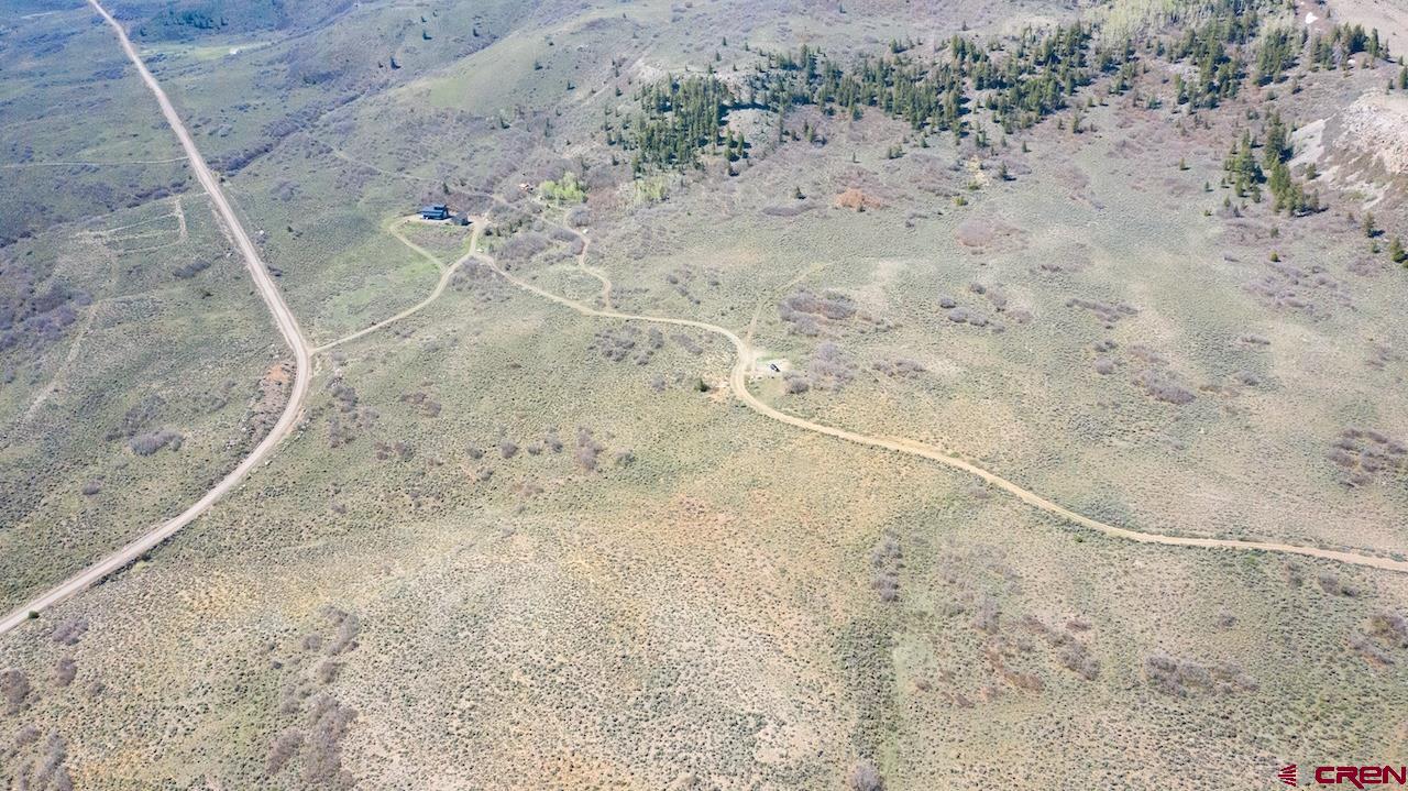 14111 County Road 26 Gunnison, CO 81230 - Photo 26 of 35 a view of a dry field with wooden fence
