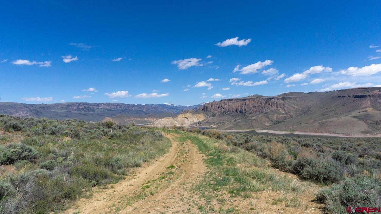 14111 County Road 26 Gunnison, CO 81230 - Photo 30 of 35 a view of a lake with mountains in the background