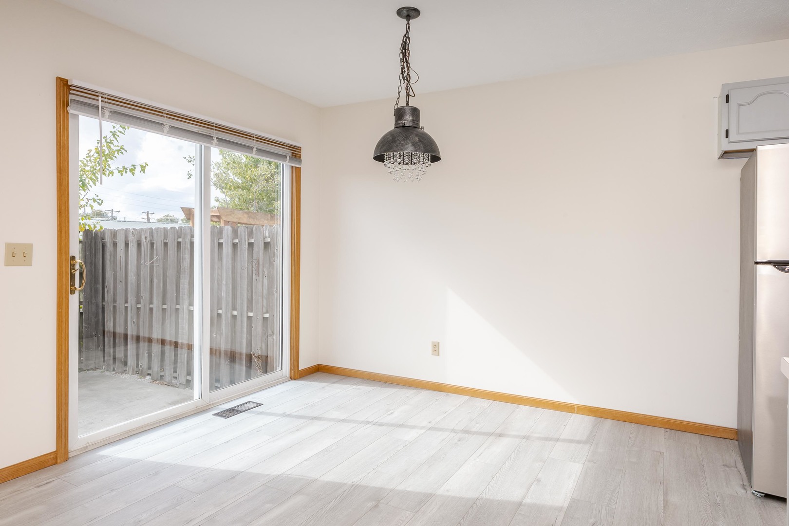 26 Vermont Avenue Bloomington, IL 61701 - Photo 11 of 37 a view of a room with wooden floor and windows