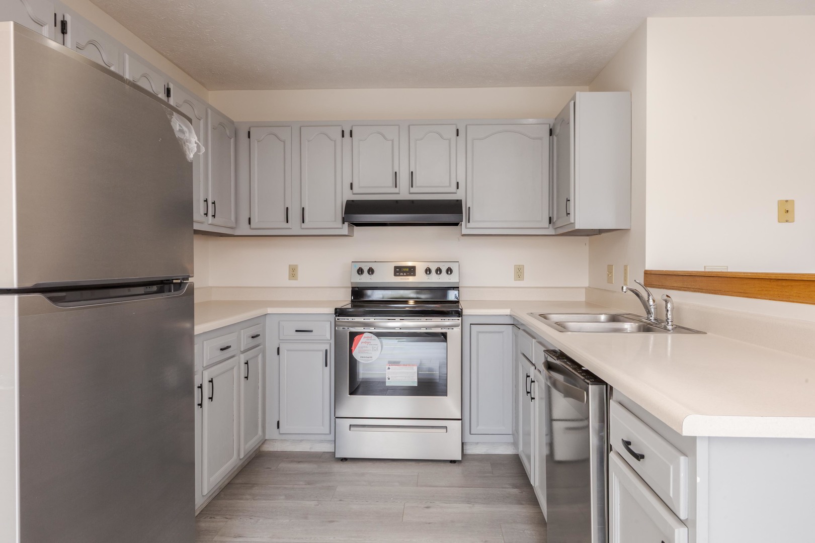 26 Vermont Avenue Bloomington, IL 61701 - Photo 13 of 37 a kitchen with stainless steel appliances granite countertop a sink stove and refrigerator