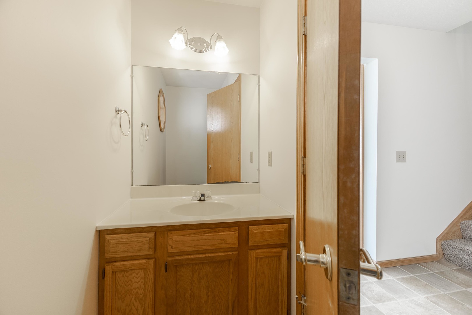 26 Vermont Avenue Bloomington, IL 61701 - Photo 14 of 37 a bathroom with a sink and a mirror