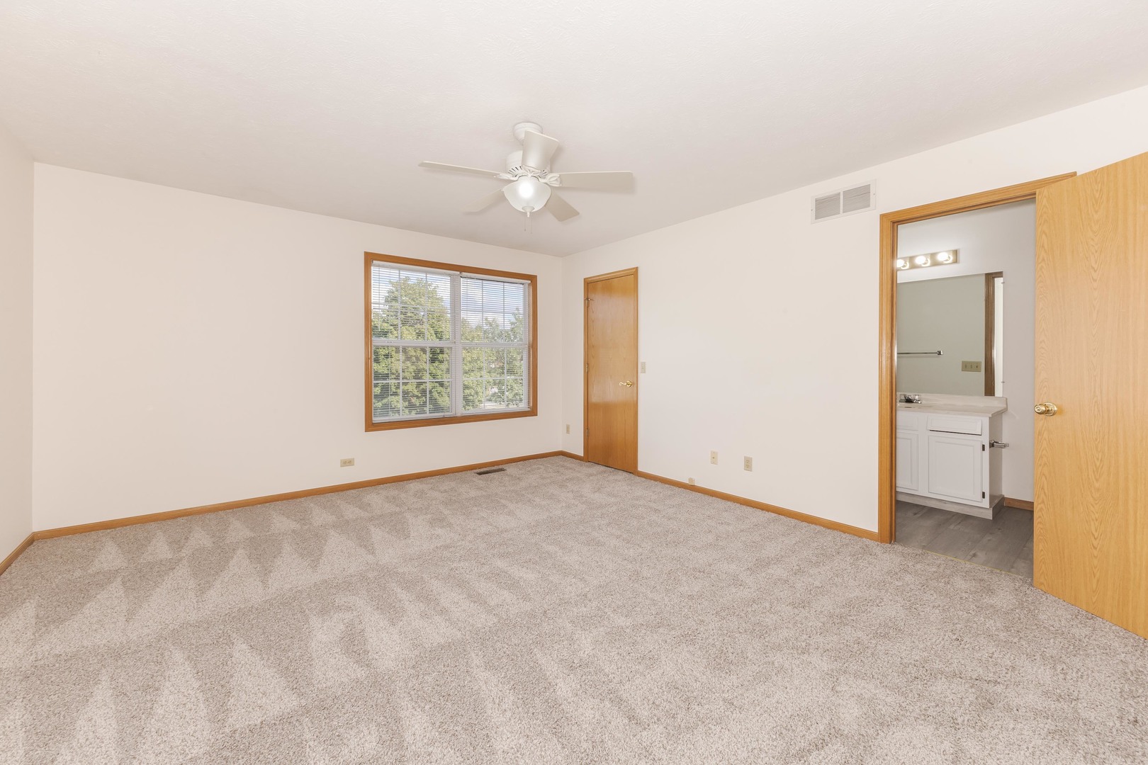 26 Vermont Avenue Bloomington, IL 61701 - Photo 17 of 37 an empty room with windows and cabinet