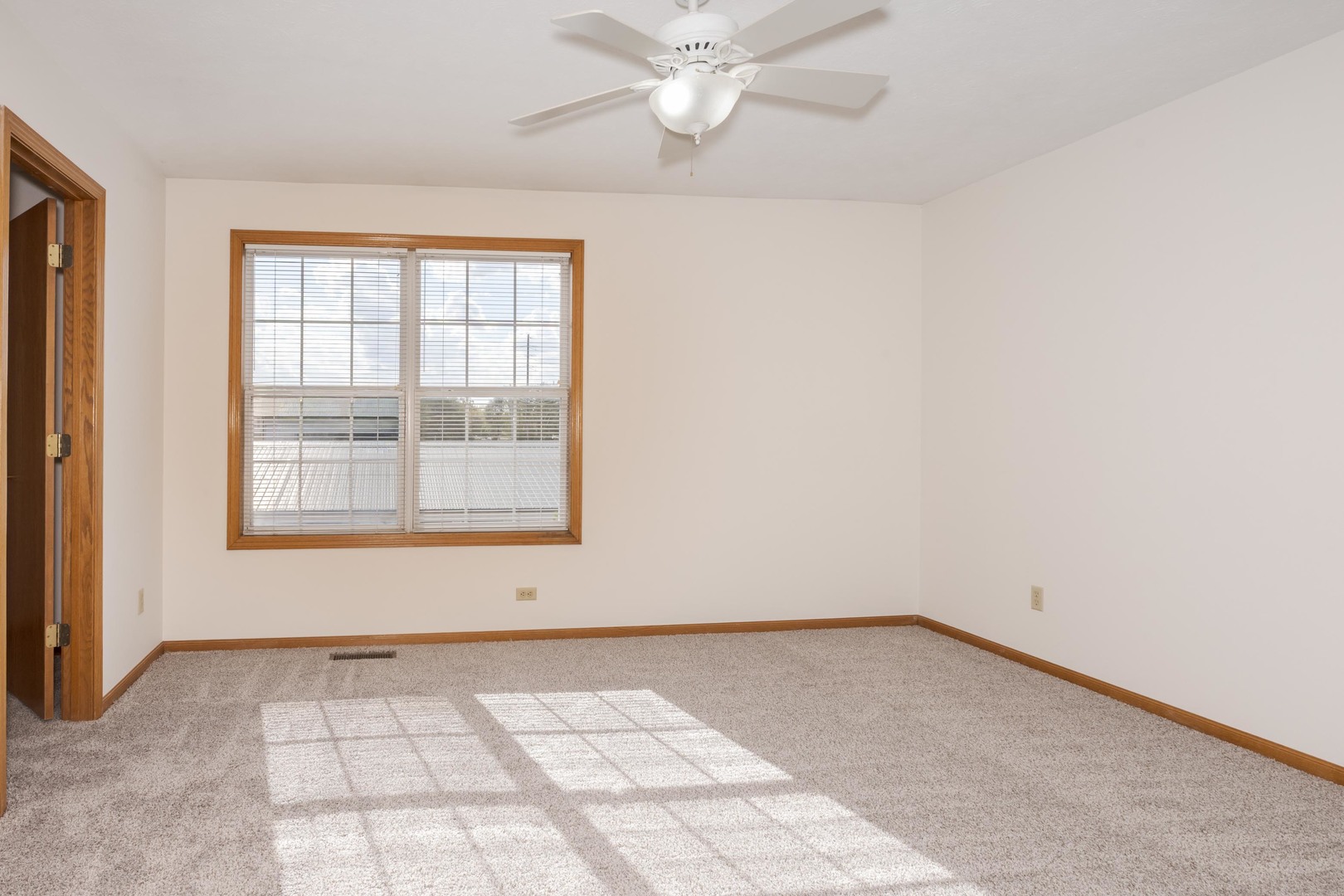 26 Vermont Avenue Bloomington, IL 61701 - Photo 22 of 37 an empty room with a window