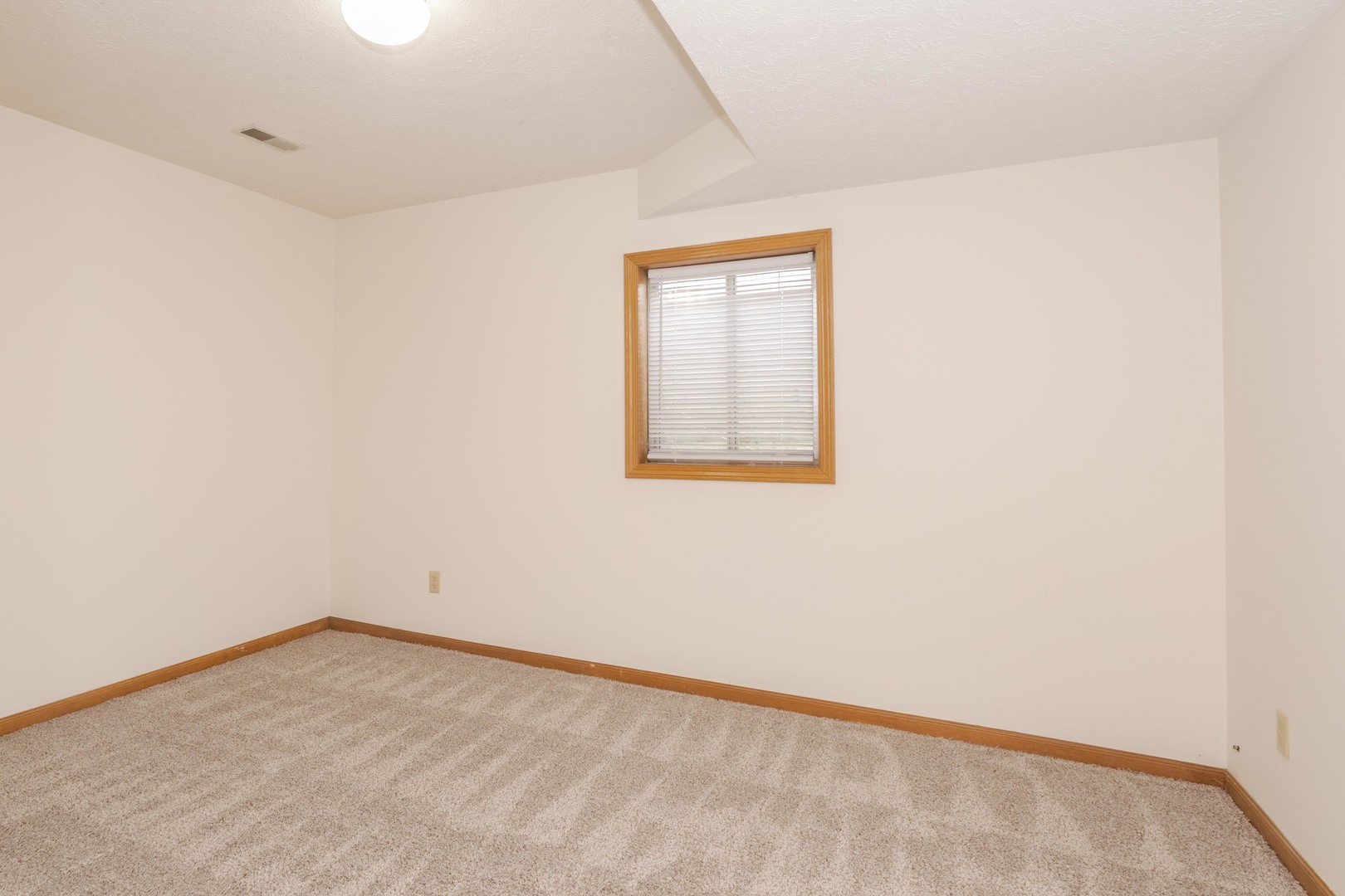 26 Vermont Avenue Bloomington, IL 61701 - Photo 26 of 37 an empty room with a workbench