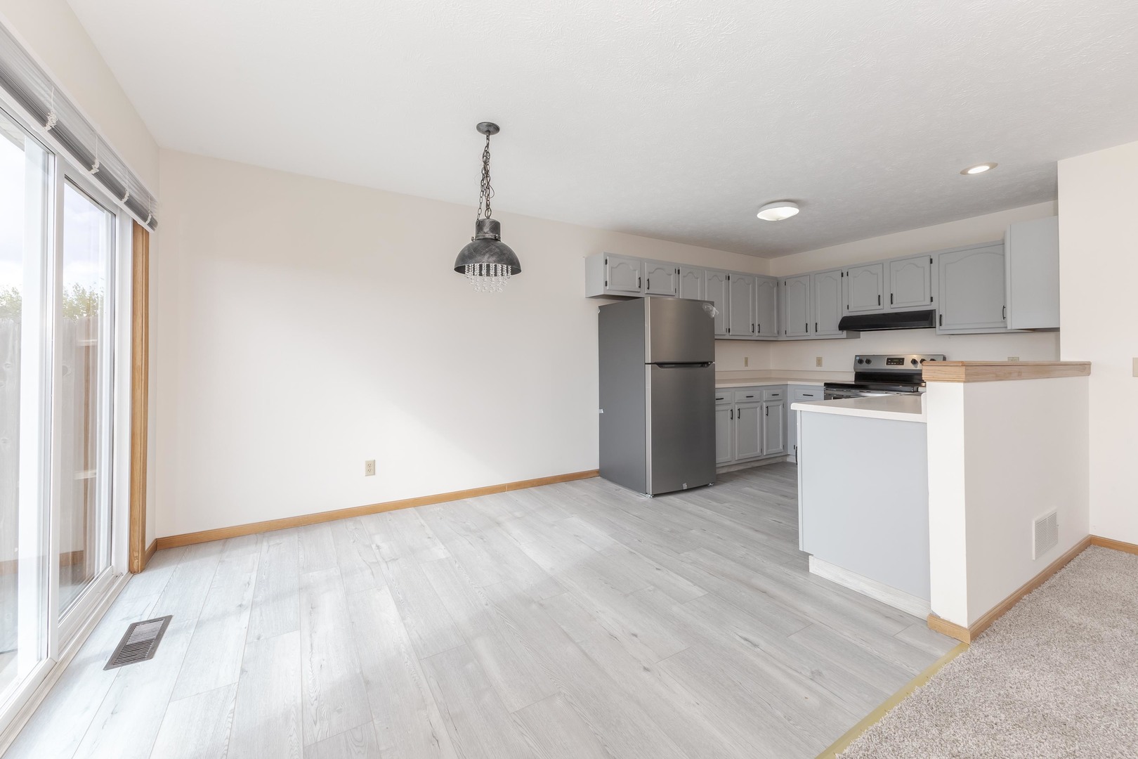 26 Vermont Avenue Bloomington, IL 61701 - Photo 9 of 37 a view of a kitchen with a sink and a refrigerator