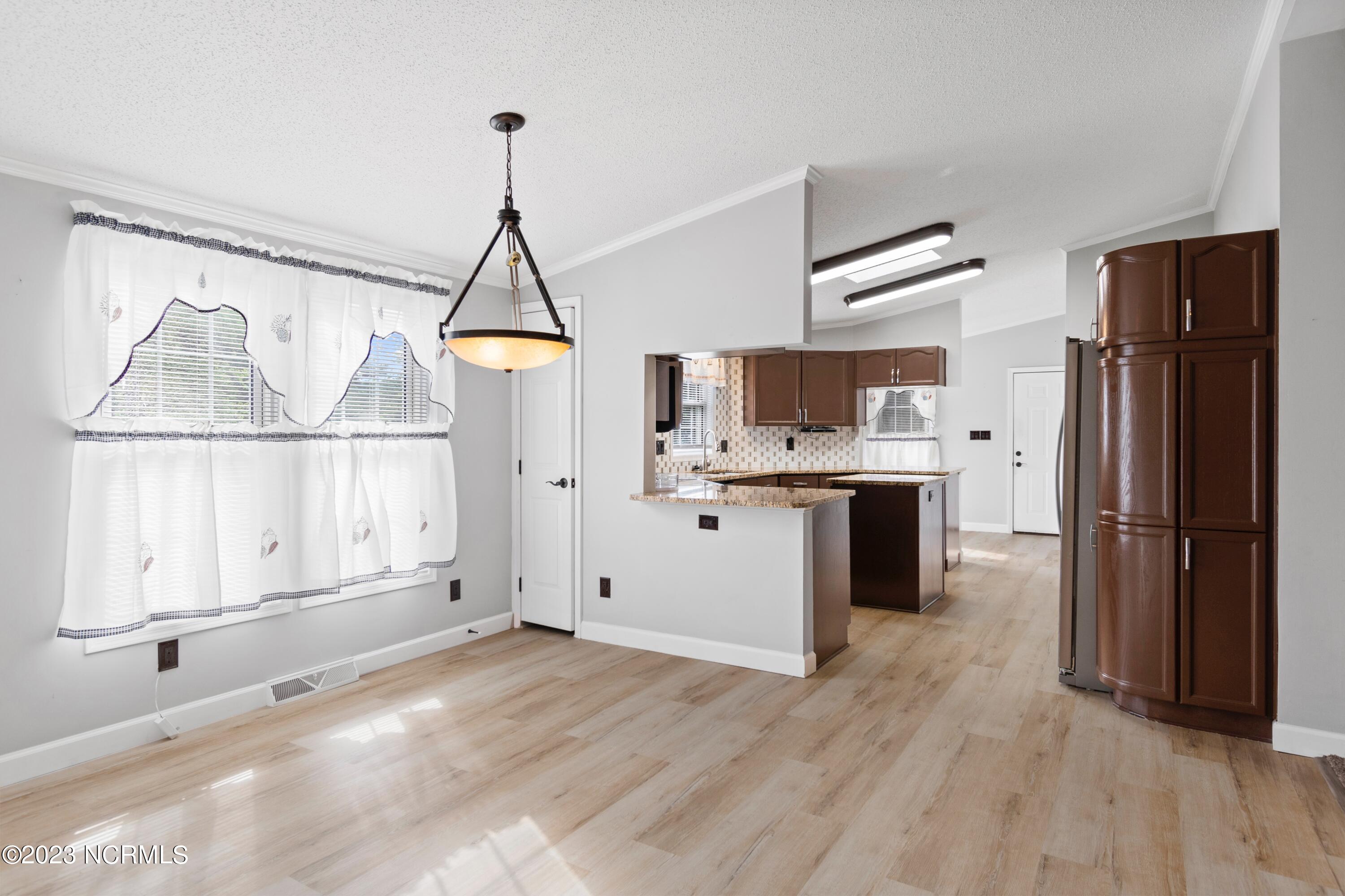 1014 Waterview Lane Southwest Calabash, NC 28467 - Photo 7 of 35 Dining room to kitchen