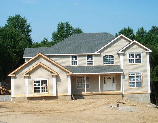 19 Charter Ridge Drive Newtown, CT 06482 - Photo 1 of 1 a front view of a house with a garden