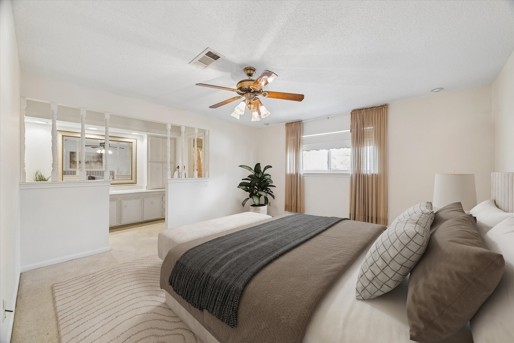 322 Enchanted River Drive Spring, TX 77388 - Photo 14 of 28 a bedroom with a large bed a chandelier and a window
