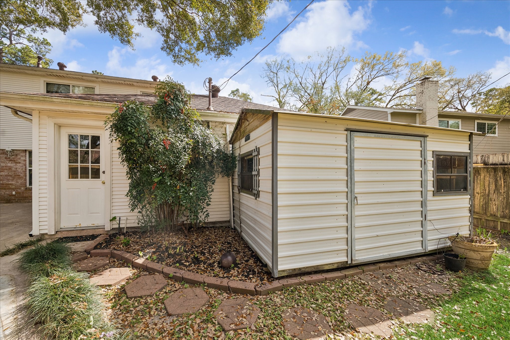 322 Enchanted River Drive Spring, TX 77388 - Photo 14 of 25 Back door to the Garage and Storage Shed