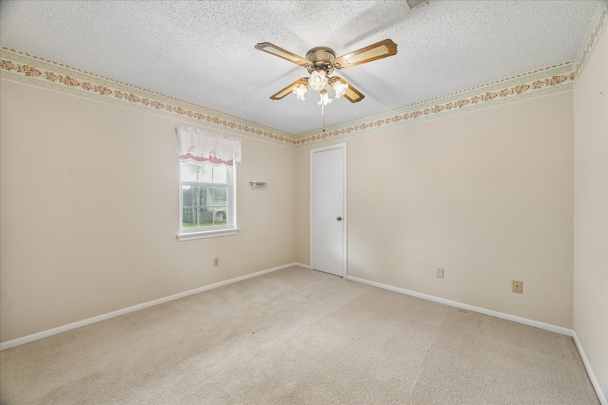 322 Enchanted River Drive Spring, TX 77388 - Photo 18 of 28 a view of an empty room with a window